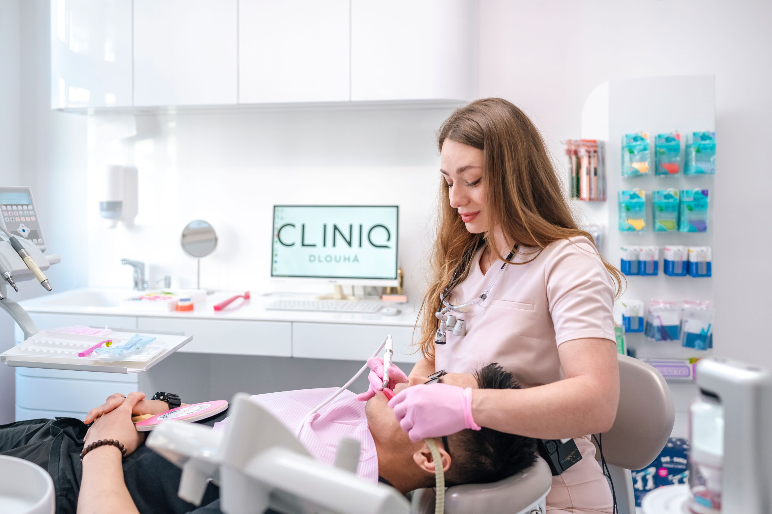 A dental hygienist performs dental hygiene